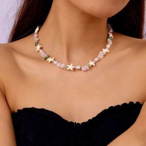 Close-up of beaded choker with white starfish charms, pink green stones and pearls