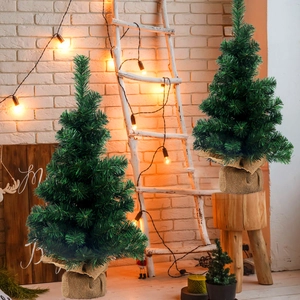 Mini Christmas trees with burlap base for holiday tabletop decoration and festive atmosphere