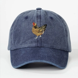 Vintage washed blue baseball cap with colorful rooster embroidery and distressed texture