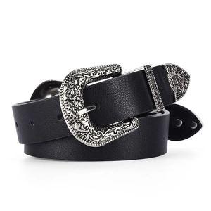Western style black leather belt featuring an oversized silver vintage carved buckle