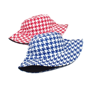 Reversible houndstooth bucket hats in red and blue colors for sun protection
