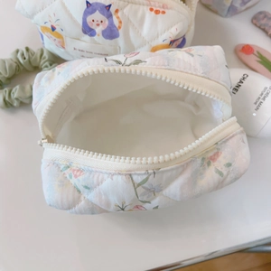 Quilted floral cotton pouch with purple cat pattern and white zipper detail