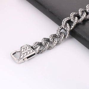 Macro shot of punk vintage silver chain links with intricate carved textures
