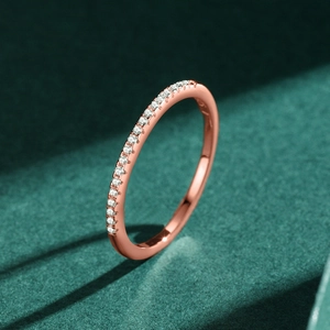 Minimalist S925 silver rose gold row diamond ring on dark green velvet background