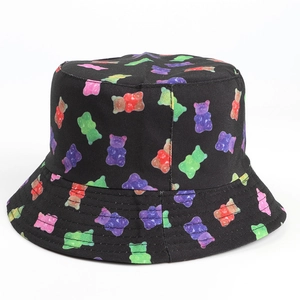 Detail of colorful gummy bear print on black cotton bucket hat with seamless pattern