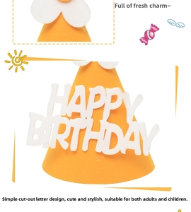 Close-up of bright orange felt birthday hat with white Happy Birthday cutout letters