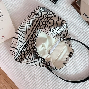 Detail of bohemian canvas tote interior featuring zipper pocket and magnetic closure