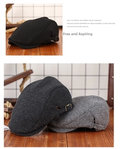 Detail view of wool blend newsboy caps with metallic side buckles and fabric texture