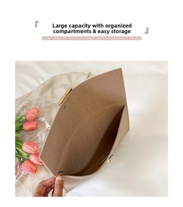 Interior view of the khaki felt envelope clutch bag featuring spacious storage and a metal lock