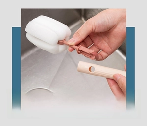 Detail view of the detachable sponge head and ergonomic non-slip handle for cup cleaning