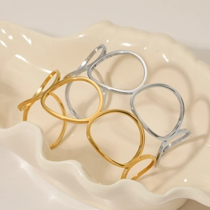 Minimalist oval open bangle in gold and silver finish with hollow ring design