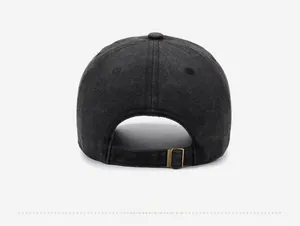 Detail view of washed gray cotton baseball cap with adjustable antique metal buckle