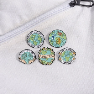 Set of eco-friendly enamel pins with Earth Day slogans on white canvas background