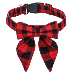 Classic red and black plaid dog collar with a large bowknot and metal D-ring attachment