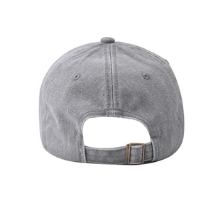 Detail of washed cotton baseball cap featuring adjustable bronze metal buckle at back