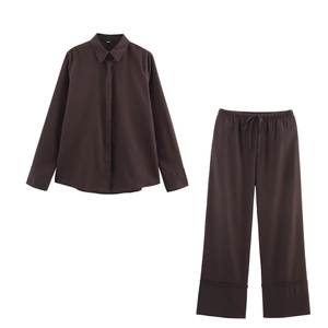 Women's dark brown linen long sleeve shirt and wide leg pants set on white background