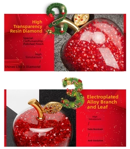 Detail of red resin crystal apple with gold alloy leaves and sparkling rhinestones