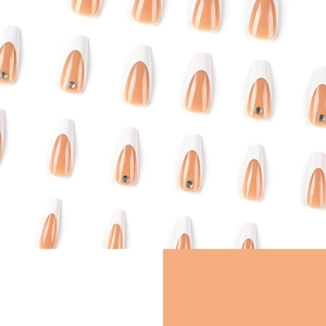 French tip coffin press-on nails with nude base color and tiny rhinestone accents