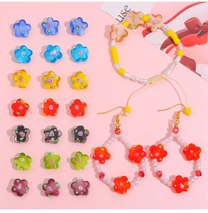 Macro view of colorful vintage plum blossom glass beads and handmade floral jewelry accessories