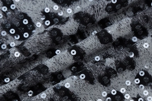 Macro shot of stylish leopard print fabric with shimmering sequins for summer dresses