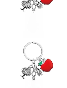 Macro view of teacher appreciation keychain with apple, tree, and owl charms