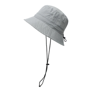 Close-up of adjustable drawstring and chin strap on light gray outdoor bucket hat