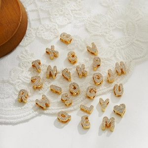 Custom gold letter charms with sparkling crystals for personalized name necklaces