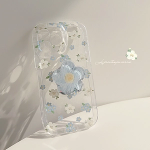 Detailed view of transparent floral iPhone case with 3D blue flower grip stand