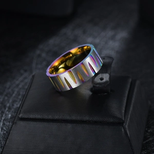 Detail showing the brushed metal texture and rainbow-colored stripes on the steel ring band