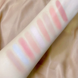 Matte and shimmer monochromatic blush swatches on arm in various natural peach and pink tones