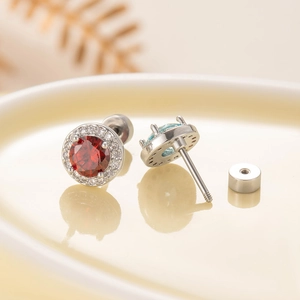 Round zircon stud earrings in red and blue with titanium steel screw backs and halo setting