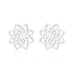 Macro detail of silver stainless steel mandala flower stud earrings with hollow design