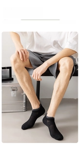 Detail of men's breathable mesh short socks with dual-ribbed cuffs in dark grey