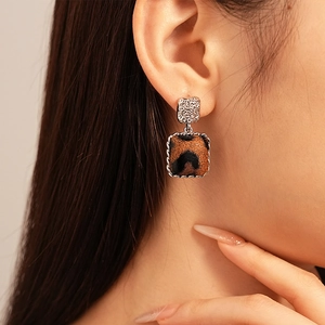 Vintage leopard print square earrings with silver needle shown on female model