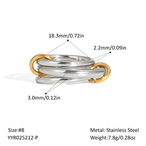 Macro detail of interlocking stainless steel rings in silver and gold-tone finish
