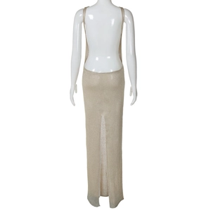 Detail view of the open back and slit hem on this beige knit sleeveless long dress
