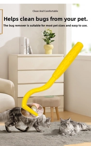 Macro detail of yellow pet tick remover tool extracting a parasite from a cat's thick fur