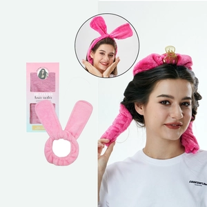 Pink plush heatless hair curler with rabbit ear design and gradient packaging box