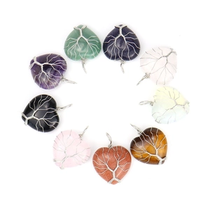 Detailed view of nine heart-shaped natural stone pendants with silver tree of life wire wrapping