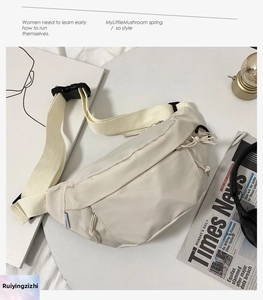 Detail of beige nylon crossbody bag with drawstring pocket and plastic buckle