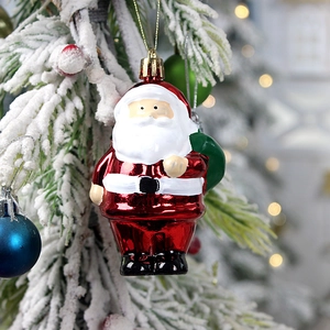 Classic Santa Claus ornament with green gift bag on a festive snowy Christmas tree