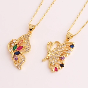 Detailed macro view of two gold necklaces featuring colorful zircon butterfly pendants