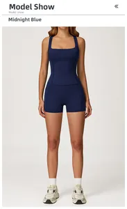 Front view of a midnight blue racerback sports top and high-waisted shorts yoga set
