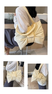Detail of light yellow nylon tote bag with large bow and natural fabric texture
