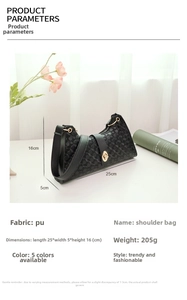 Detail view of black PU shoulder bag with circle embossed texture and gold lock
