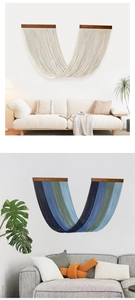 Close-up of bohemian gradient fringe tapestry with wooden beam in a modern living room