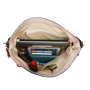 Top view of the spacious bohemian woven tote interior showing organized storage and lining