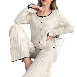 Women's two-piece loungewear set with ribbed knit cardigan and wide-leg pants in cream