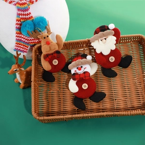 Christmas plush ornaments featuring Santa, Snowman, and Reindeer in a rustic woven basket