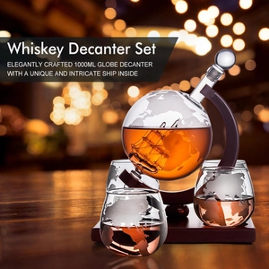 Globe whiskey decanter set with internal glass ship model on elegant wooden base